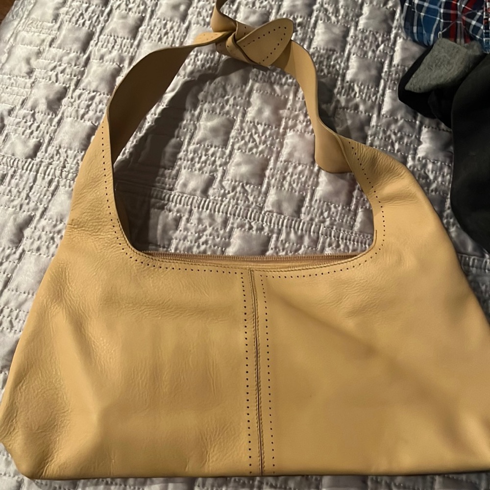 Beige Furla bag.